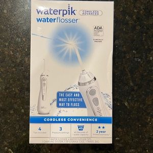 NEW IN BOX Waterpik waterflosser with 4 tips, 3 pressure settings - unopened